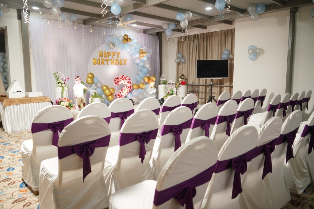 Banquet hall at Hotel Chaitali decorated for a birthday celebration