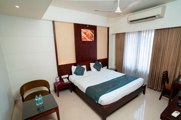 Deluxe A/C room at Hotel Chaitali with workspace and seating