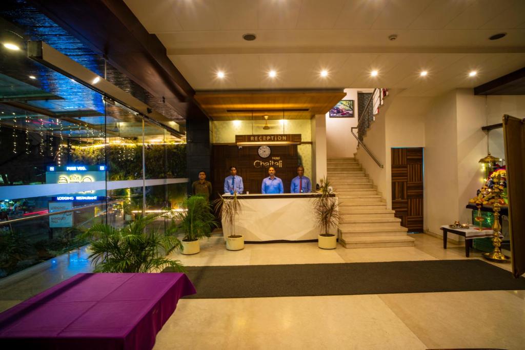 Hotel Chaitali reception desk with staff in the lobby